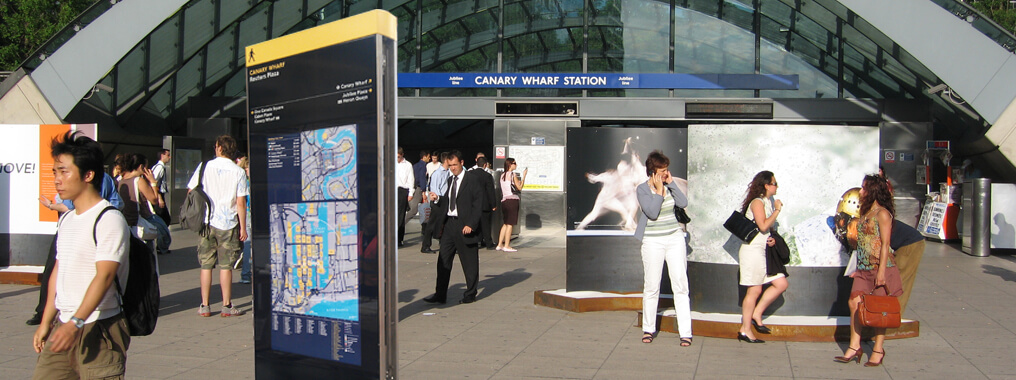 Outdoor digital wayfinding totem outside of the Canary Wharf Station in London.