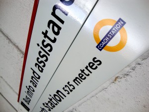 close up of wall mounted directional signage.