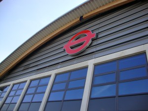 wall mounted roundel on front of building.
