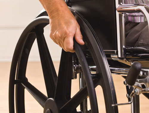 close up of wheelchair wheel being used.