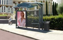 sinewave bus shelter installed at side of road.