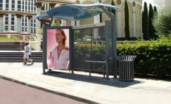 sinewave bus shelter installed at side of road.